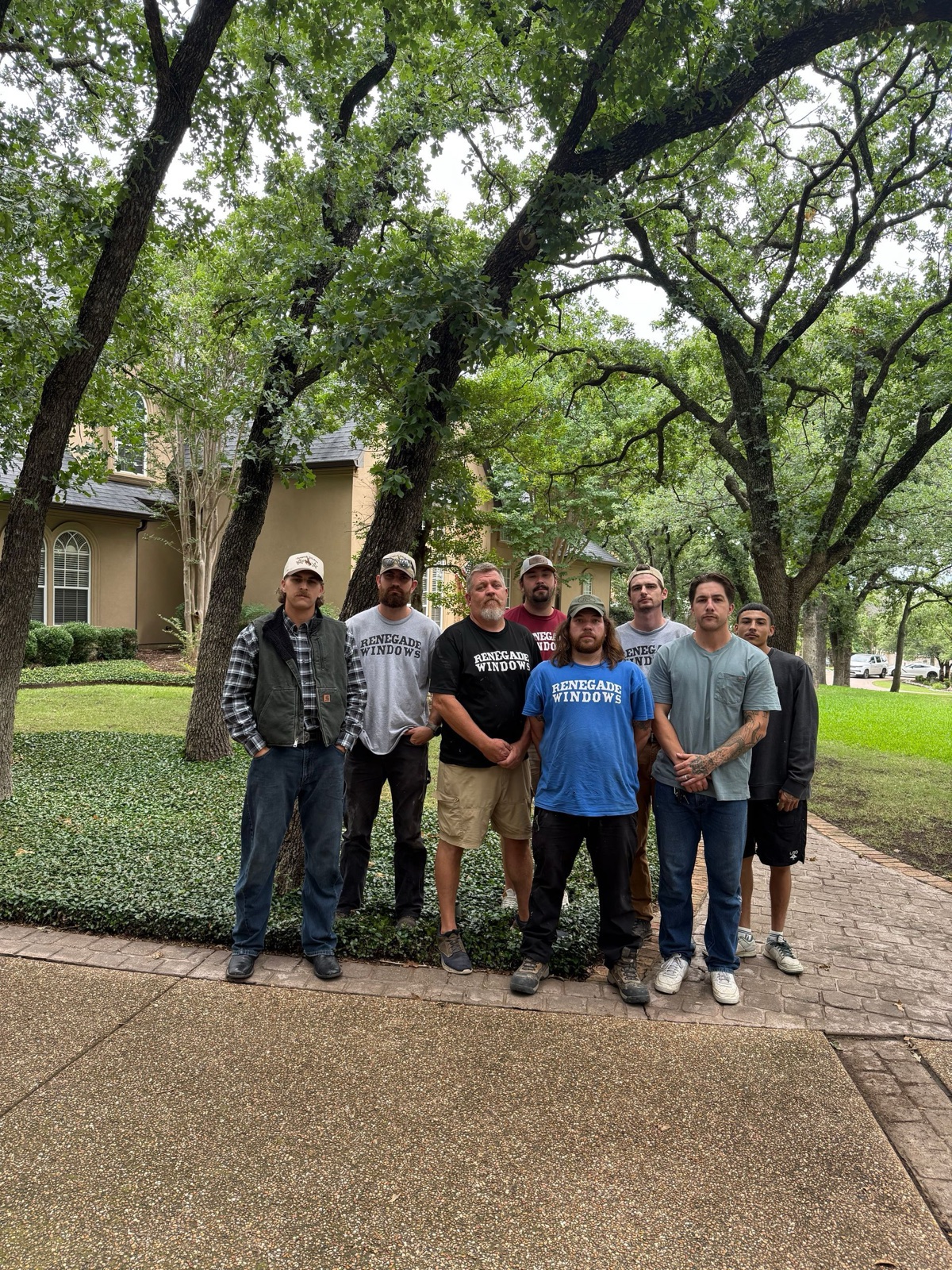 Renegade Windows field team outside a completed home