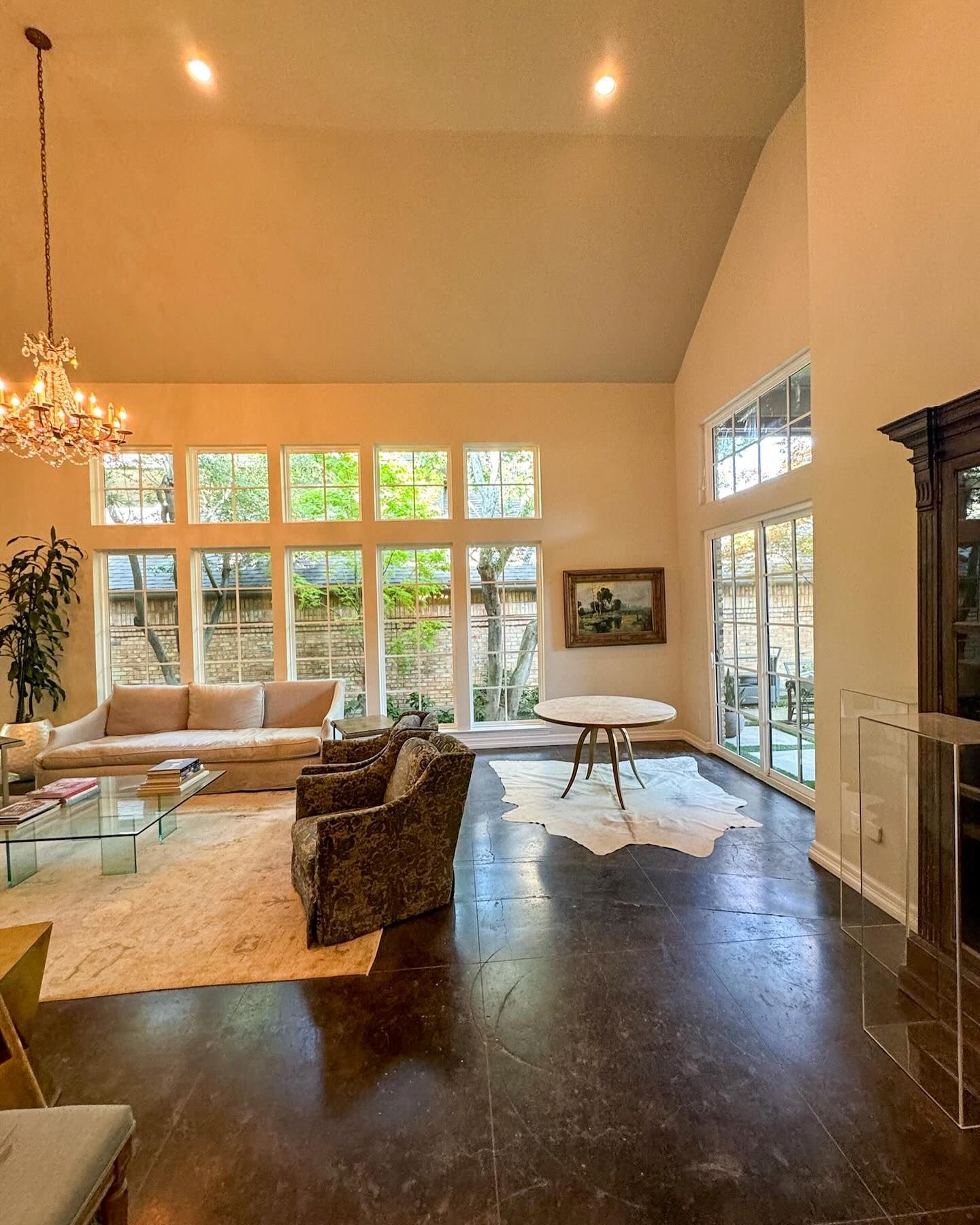 Tall windows filling a vaulted living room with natural light